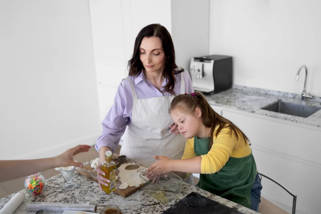 high angle woman girl making cookies